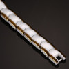 Women's polished white ceramic bracelet with magnetic gold edges