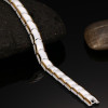 Pulsera de mujer de cerámica blanca pulida con bordes magnéticos dorados