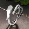 Silver open ring with infinite crossed lines