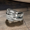 Anello aperto da donna a linee incrociate in argento