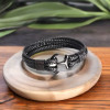 Bracciale da uomo con cordini in cuoio intrecciato nero e ancora in acciaio