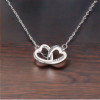 Colgante collar doble corazón en plata rodiada y circonita