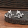 Men's silver earrings with pink skull studs