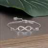 Pulsera infinita de plata 925 con placa de rodio y circonitas engastadas.