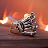 Men's silver skeleton hand Maltese cross ring