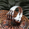 Men's silver skeleton hand Maltese cross ring