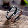 Personalized men's braided leather bracelet with steel curb