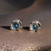 Men's silver snake stud earrings with topaz stone