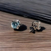 Men's silver snake stud earrings with topaz stone