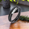 Bracciale uomo in pelle nera intrecciata con chiusura in acciaio