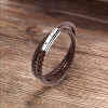 Bracciale uomo in pelle nera intrecciata con chiusura in acciaio