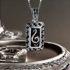Pendentif homme plaque note de musique clef acier