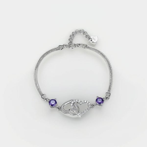 Pulsera de mujer con forma de corazón en plata con baño de rodio y montura de circonitas.