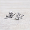 Men's silver earrings with pink skull studs