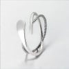 Silver open ring with infinite crossed lines