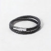 Bracciale uomo in pelle nera intrecciata con chiusura in acciaio