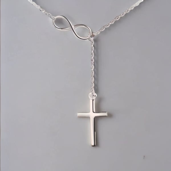 Colgante collar cruz infinito plata rodiada