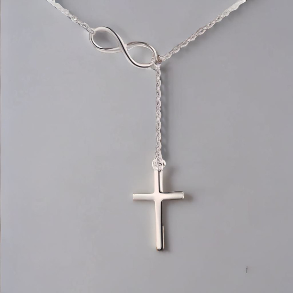 Colgante collar cruz infinito plata rodiada