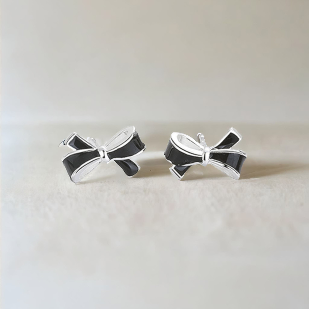 Silver bow tie stud earrings