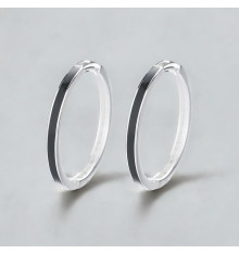 Silver creole earrings with black resin