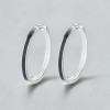 Silver creole earrings with black resin