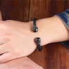 Bracelet jonc cuir tressé tête de mort