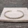 Bracciale Aperto Intrecciato in Argento Massiccio per Uomo e Donna
