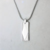 Pendentif barre facetté acier