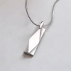 Pendentif barre facetté acier