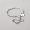 Bracelet personnalise femme gourmette coeur cisele acier plaque or personnalise