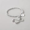 Bracelet personnalise femme gourmette coeur cisele acier plaque or personnalise