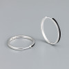 Silver creole earrings with black resin
