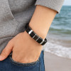 Bracelet homme cuir double cordon anneau fermoir acier aimante
