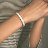 Damenarmband aus polierter weißer Keramik mit magnetischen Goldkanten