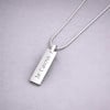 Pendentif barre facetté acier