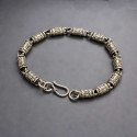 Herenarmband van zilvercilindrisch oxide met OM-patroon