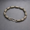 Men's silver cylindrical oxide bracelet with OM motif