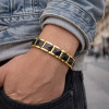 Pulsera de hombre de cerámica negra con baño de oro.