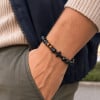Bracelet élastique onyx et œil de tigre avec croix