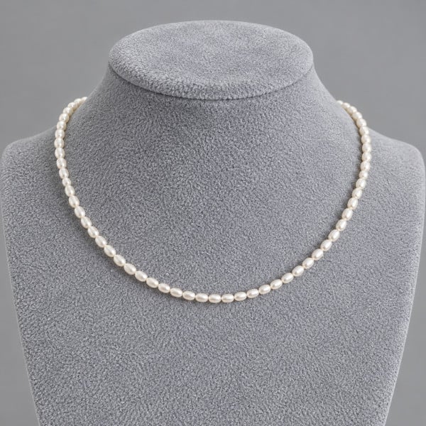 Collana di perle d'acqua dolce ovali bianche AAA da 2-3 mm con chiusura GF 14k