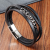 Pulsera de cuero trenzado con múltiples cordones y cierre cruzado de acero.