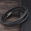 Pulsera de hombre de piel trenzada con cordón negro y cierre magnético de acero.
