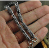 Men's silver cylindrical oxide bracelet with OM motif