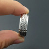 Anillo hombre antiestrés trenza giratoria plata