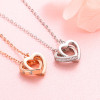 Colgante collar doble corazón en plata rodiada y circonita