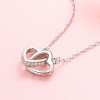 Colgante collar doble corazón en plata rodiada y circonita