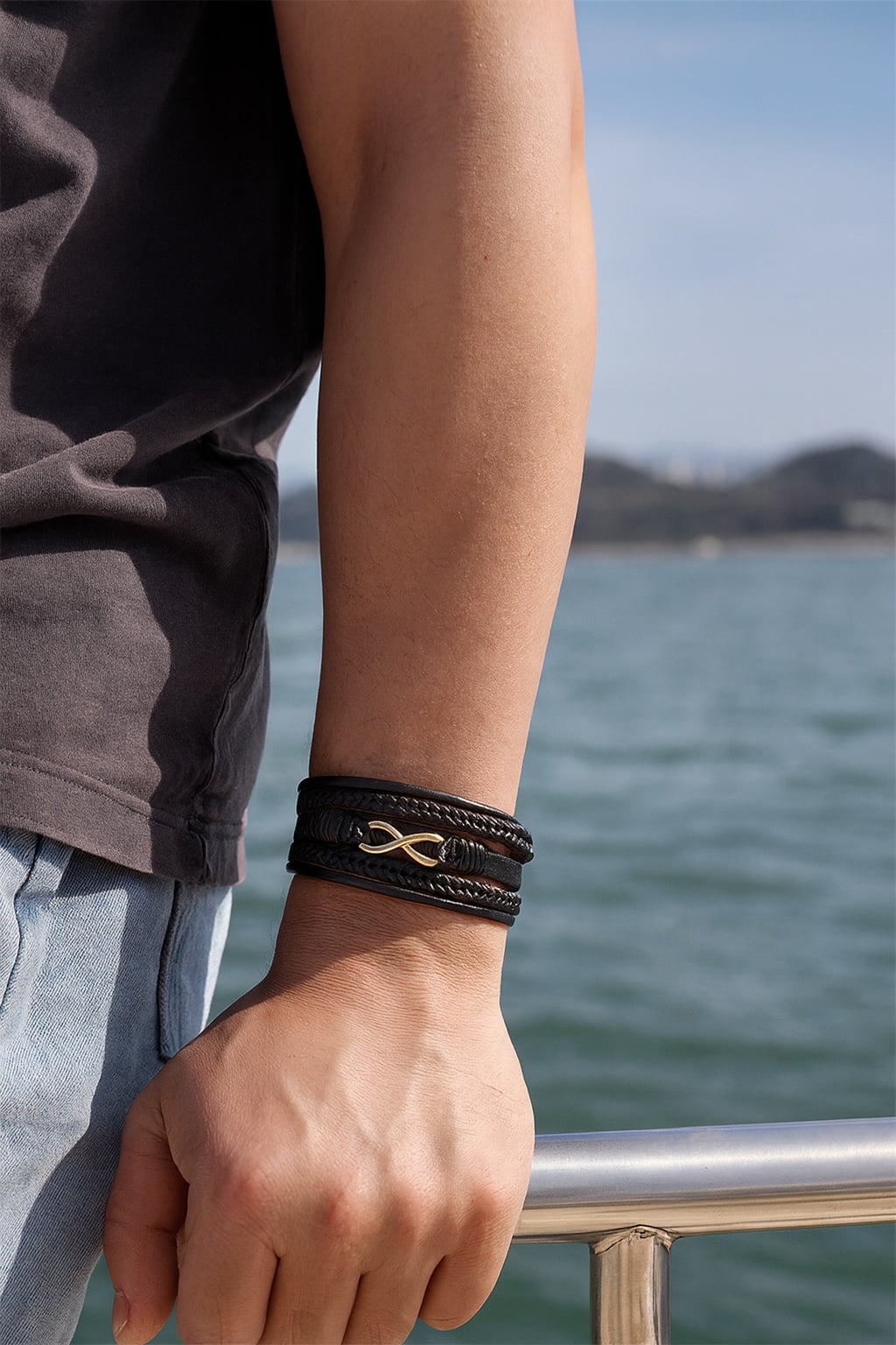 Men's black braided leather bracelet with infinity symbol