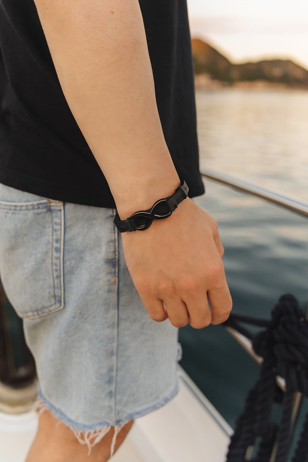 Men's black leather bracelet with infinity symbol